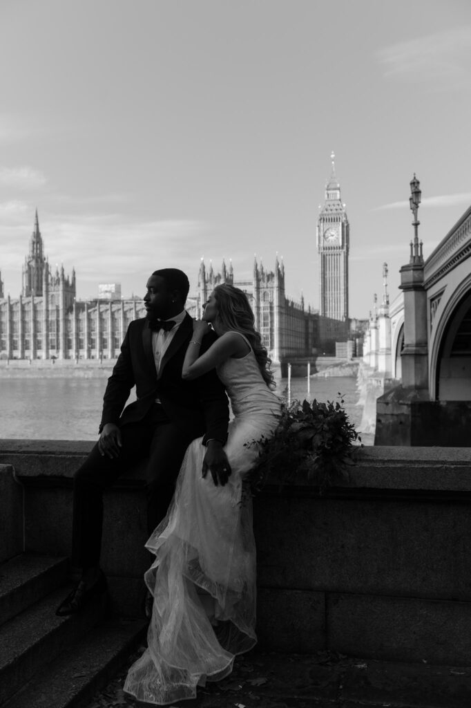 Couple in wedding clothes in London, UK by Big Ben. photographed by destination wedding photographer The Hazel Club photography