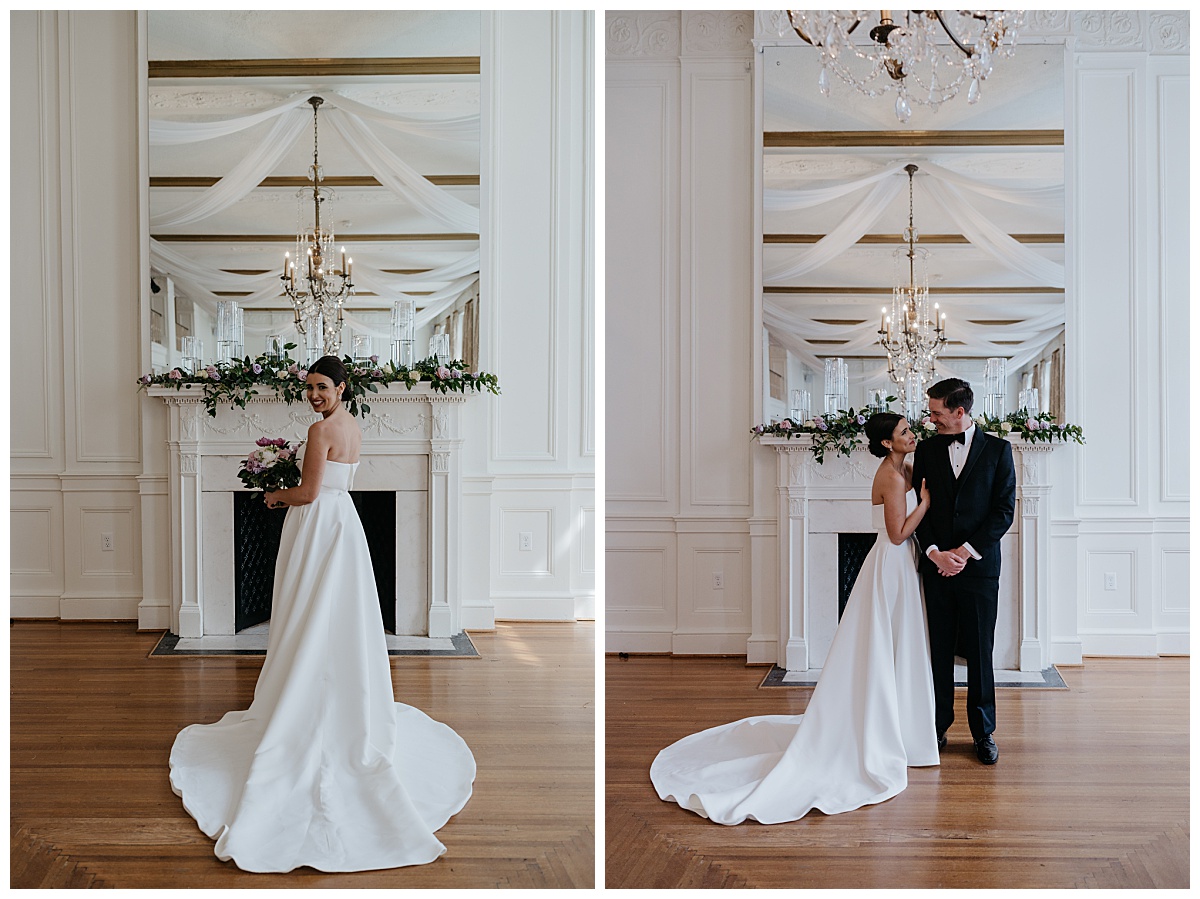 couple looks at each other standing close in front of fireplace at Hotel Concord