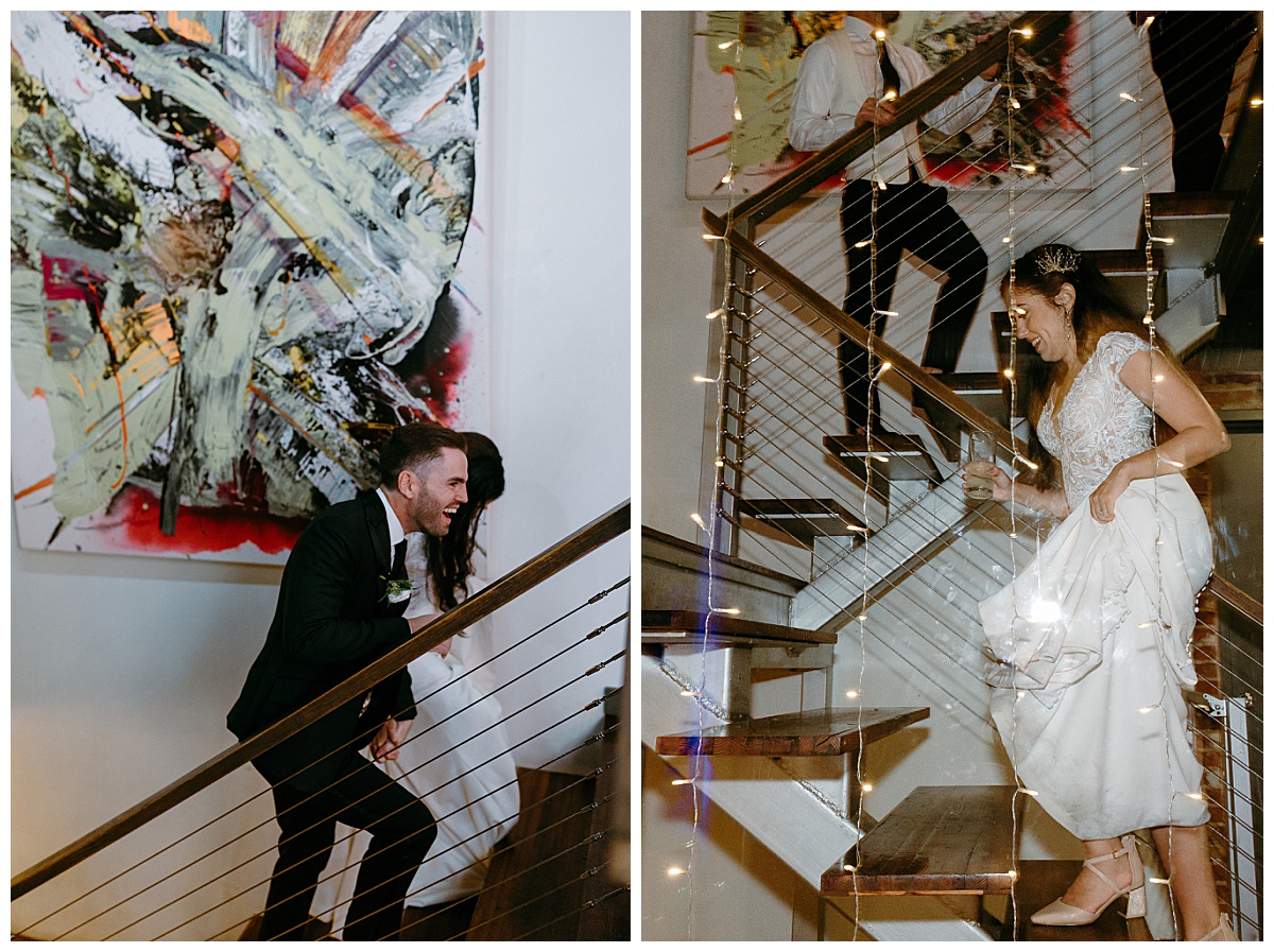 bride and groom climb stairs at art gallery by The Hazel Club