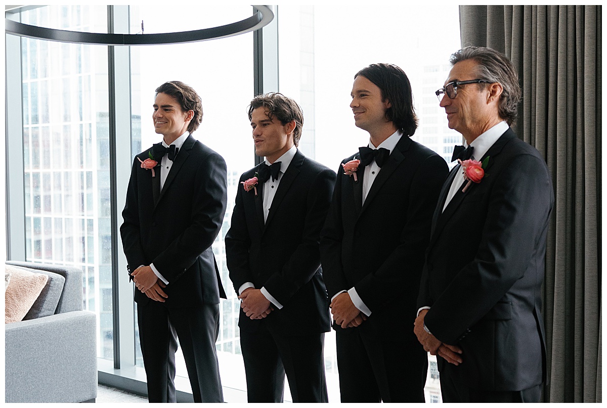 groomsmen see bride for the first time by Charlotte wedding photographer